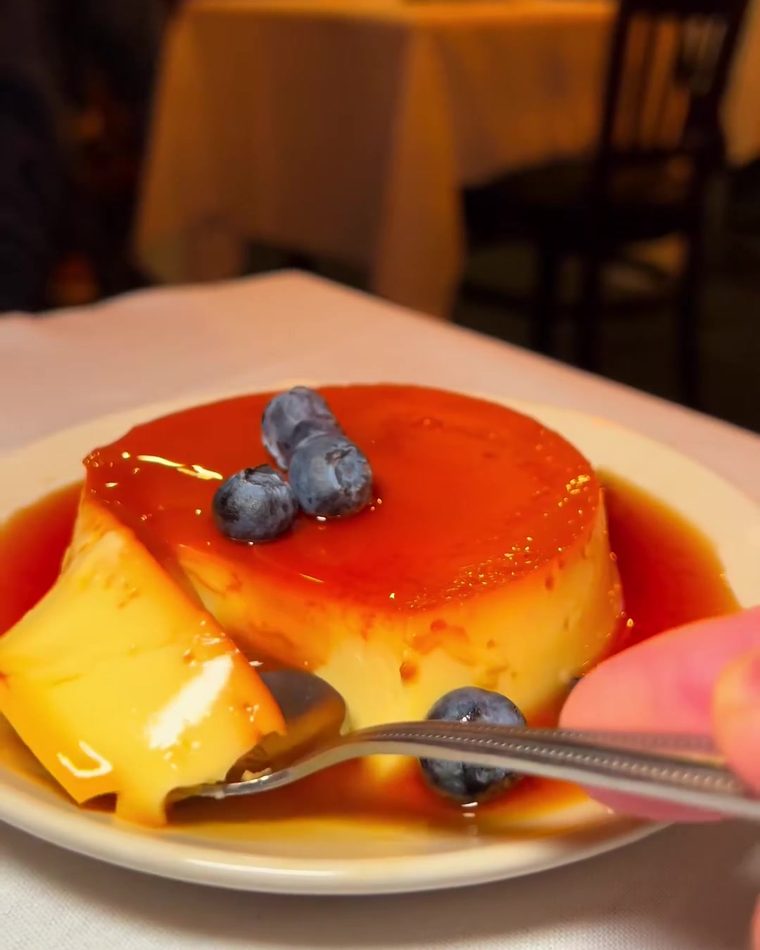 Flan with caramel and blueberries
